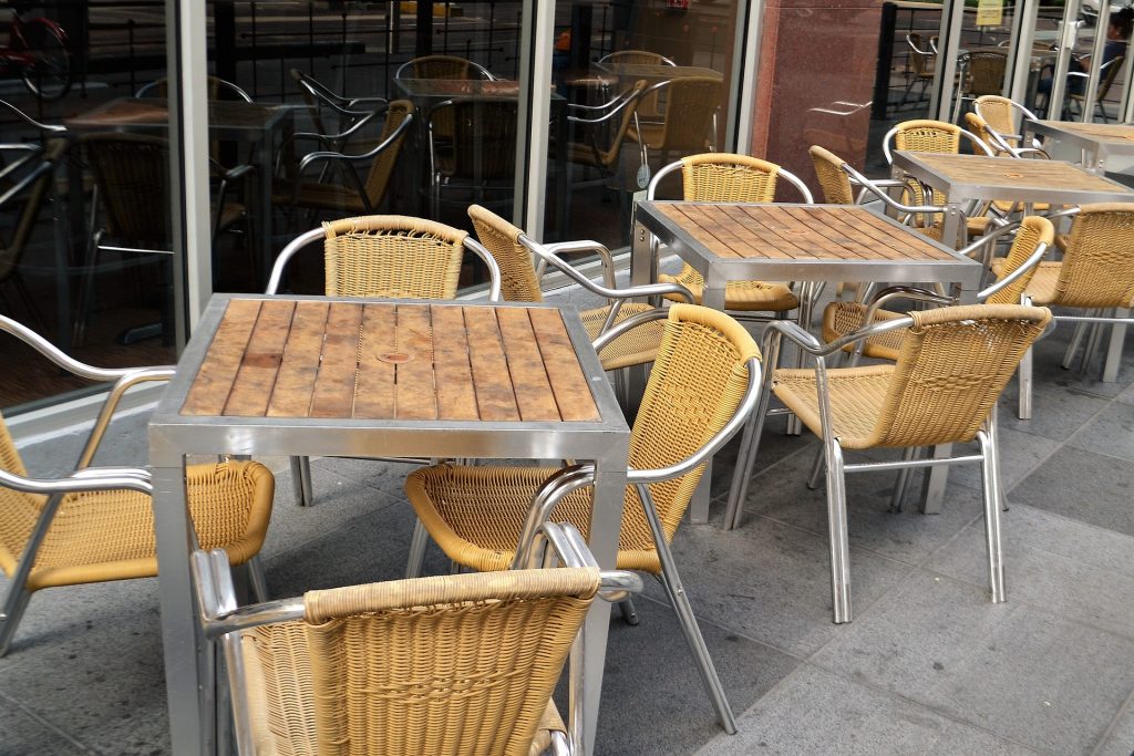 image of cafe chairs and tables with no patronage at cafe